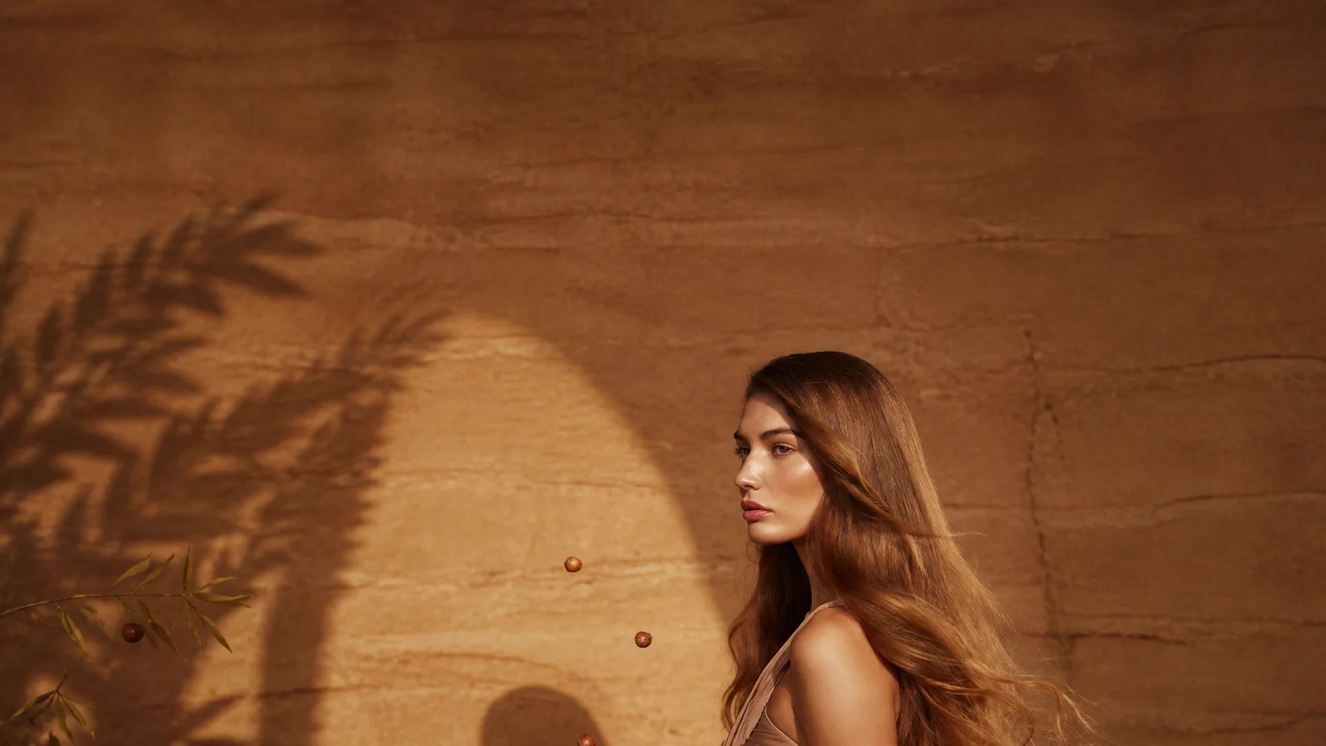 Model with long softly waved chestnut hair for the Celine Claire Argan Hydration Routine.