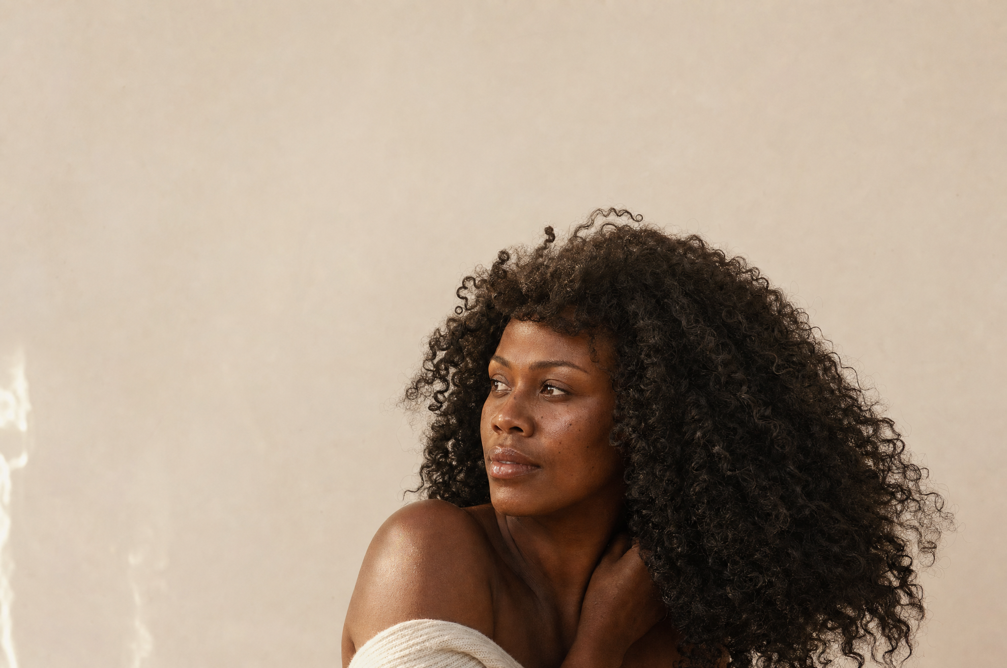 Natural coily curls with authentic separation and movement