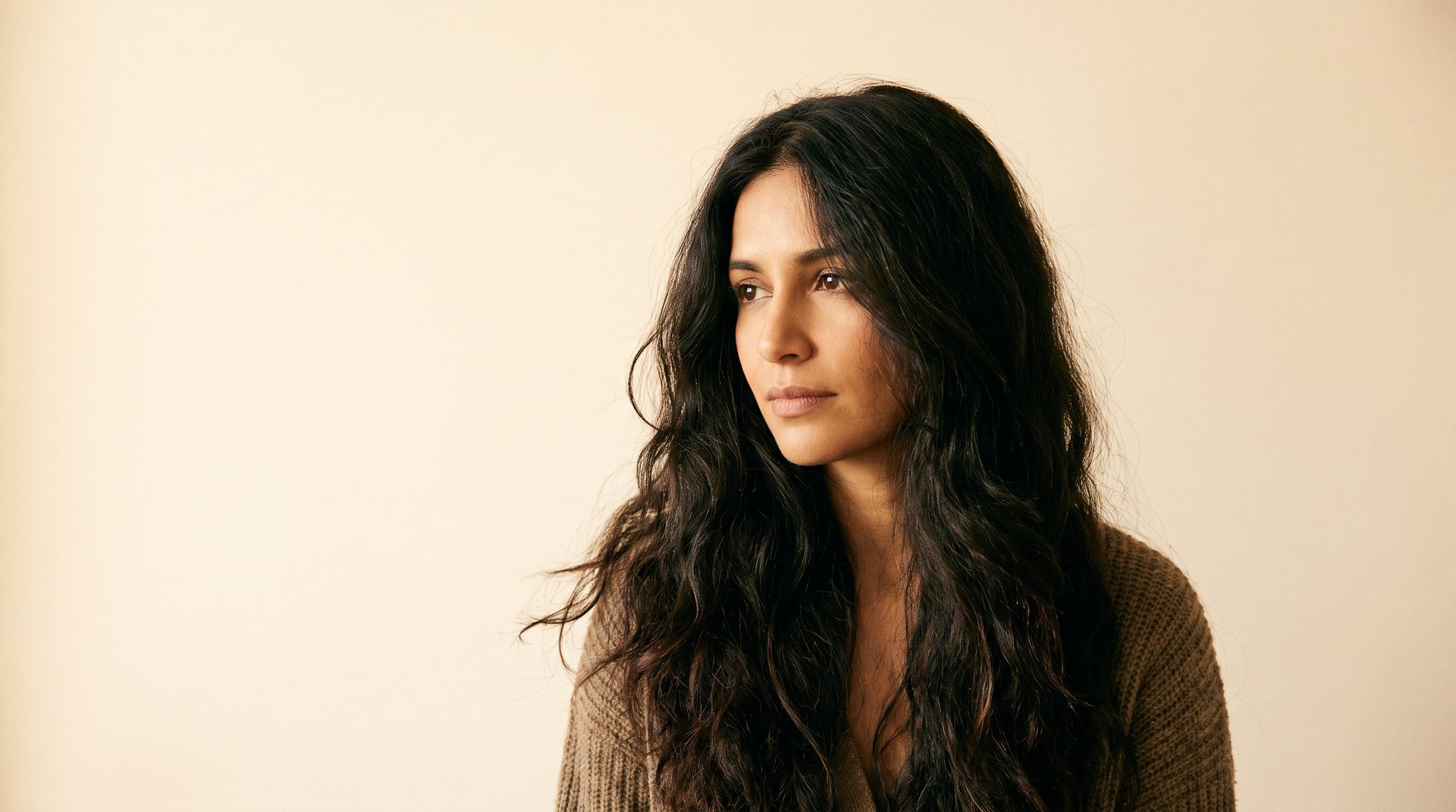 Long dark hair with strong believable texture and honest styling history