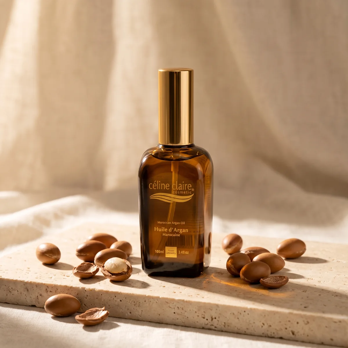 Celine Claire Moroccan Argan Oil on cream travertine with real argan nuts