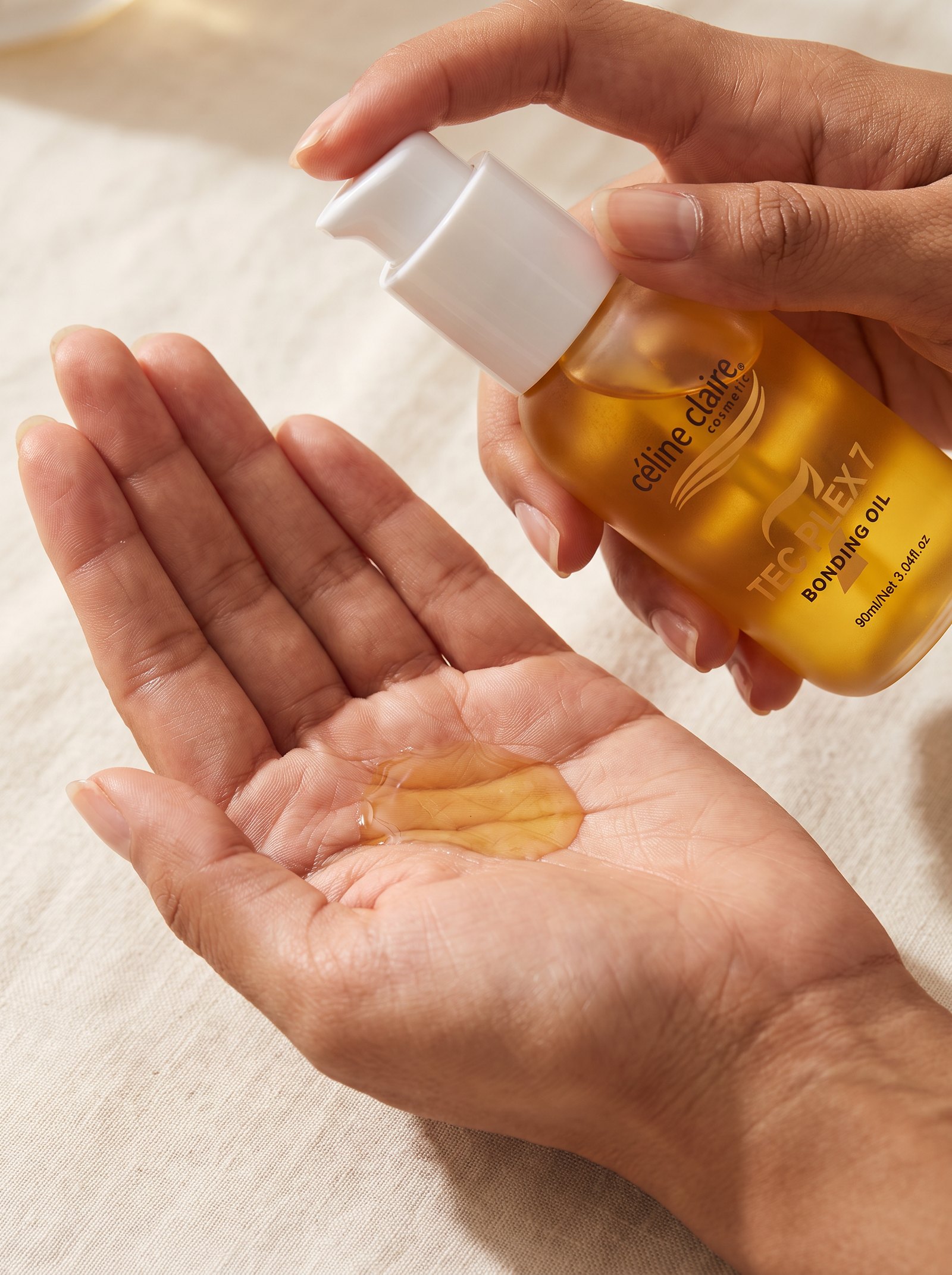 A small measured amount of Bonding Rosemary Oil in the palm